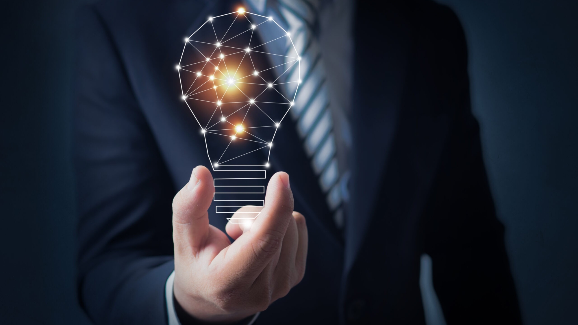 Innovation and creative market concept, business man holding bright light bulb in hand of imagination power